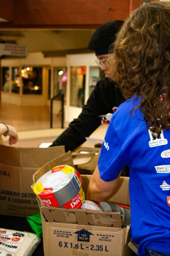 Volunteers organizing donations at Cardboard for Kitty